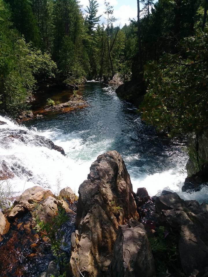 lake image above a waterfall at Kukagami Lake in Ontario